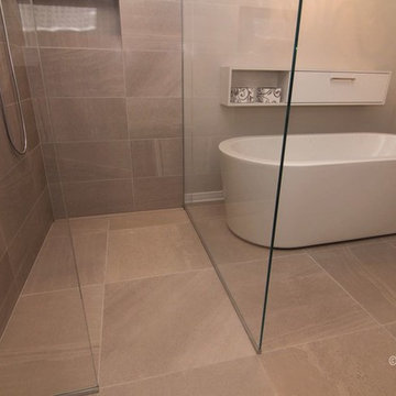Curbless shower with chandelier and separate tub
