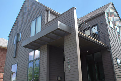 Photo of a contemporary two-storey exterior in Indianapolis with a gable roof.