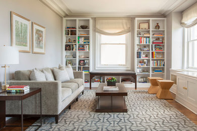 Example of a mid-sized eclectic enclosed light wood floor and beige floor family room library design in Chicago with gray walls, no fireplace and no tv