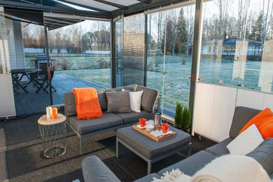 Inspiration for a mid-sized contemporary carpeted sunroom remodel in Toronto with a glass ceiling