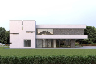 Photo of a large contemporary two-storey concrete house exterior in Dusseldorf with a flat roof.