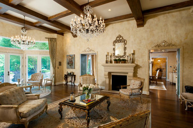 Inspiration for a large mediterranean formal and enclosed dark wood floor living room remodel in DC Metro with beige walls and a standard fireplace