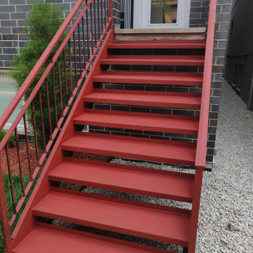 Metal porch refinishing. Rust removal, prming and painting.