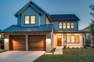 Mid-sized cottage beige two-story mixed siding gable roof photo in Dallas