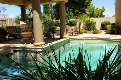 Mid-sized transitional backyard stone and l-shaped lap pool photo in San Diego