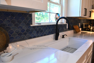 Kitchen - traditional kitchen idea in Richmond with shaker cabinets, white cabinets, quartz countertops and white countertops