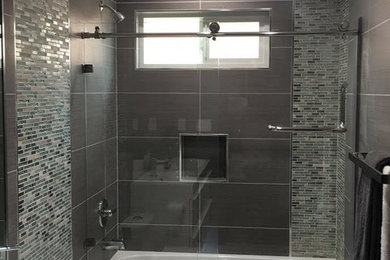 Bathroom - mid-sized traditional 3/4 gray tile and ceramic tile cement tile floor bathroom idea in San Francisco with gray cabinets, a one-piece toilet and gray walls