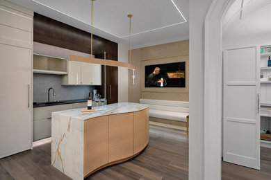 Mid-sized modern single-wall wet bar in Chicago with an undermount sink, flat-panel cabinets, light wood cabinets, quartz benchtops, dark hardwood floors, brown floor and white benchtop.