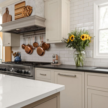 Warm Traditional Kitchen Remodel with Cream Cabinets & Herringbone Floors