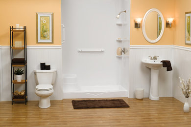 Mid-sized transitional porcelain tile and brown floor alcove shower photo in Austin with orange walls and a pedestal sink