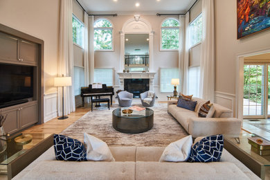 Family room - transitional light wood floor family room idea in Other