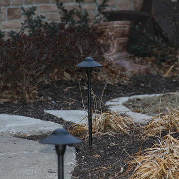 Deck lighting using low voltage under railing LED lights.