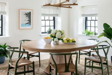 Inspiration for a large transitional light wood floor and brown floor kitchen/dining room combo remodel in Philadelphia with white walls