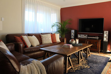 Photo of a medium sized contemporary open plan games room in Central Coast with red walls, light hardwood flooring and a wall mounted tv.