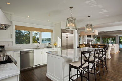 Large elegant l-shaped dark wood floor eat-in kitchen photo in Boston with an undermount sink, shaker cabinets, white cabinets, marble countertops, white backsplash, subway tile backsplash, stainless steel appliances and an island