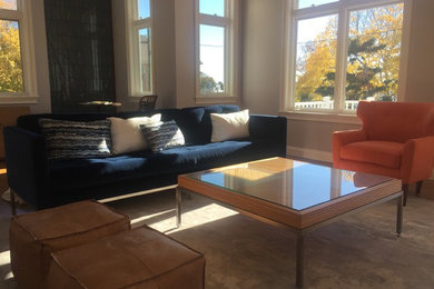 Inspiration for a large contemporary open concept medium tone wood floor and brown floor living room remodel in New York with gray walls and no tv
