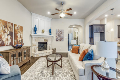 Example of a mid-sized transitional open concept carpeted game room design in Dallas with a corner fireplace, a stone fireplace and a media wall