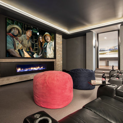 Example of a mountain style home theater design in Minneapolis