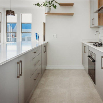 KITCHEN CONNECTING WITH LIVING SPACES