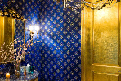 This is an example of a mediterranean powder room in Other.