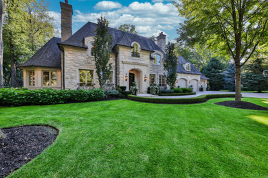 Example of a french country exterior home design in Toronto