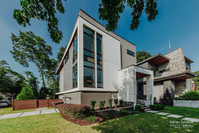 Inspiration for a mid-sized modern gray three-story concrete fiberboard and clapboard exterior home remodel in Atlanta with a white roof