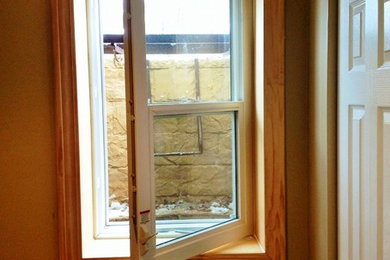 Basement - small craftsman underground basement idea in Grand Rapids with beige walls