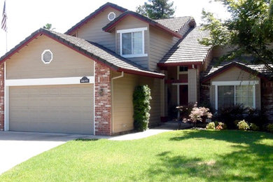 Inspiration for a mid-sized transitional beige two-story wood house exterior remodel in Other