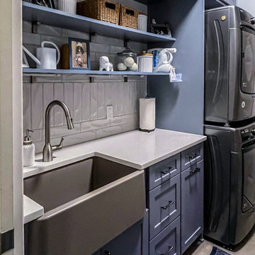 Laundry Room with Blue Painted Cabinetry and Sparkling White Quartz Countertops