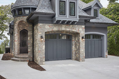 Traditional gray two-story mixed siding house exterior idea in Grand Rapids with a shingle roof