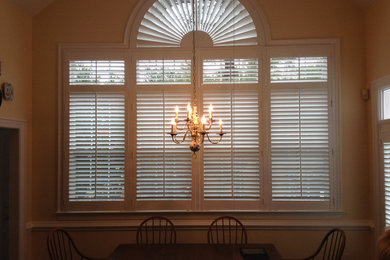 Example of a dining room design in Other with white walls