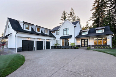 Huge farmhouse white two-story mixed siding and board and batten exterior home idea in Portland with a mixed material roof and a black roof