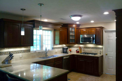 Example of a classic kitchen design in Other