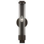 Livex Lighting - Castleton 1 Light Bronze Tall ADA Single Sconce - A glass cylinder shines with light as steel straps and a rounded back plate ground this Castleton sconce with a modern style. The clean, transitional, versatile sleek look will add romantic light while maintaining your minimalist interior. This beautiful sconce comes in an bronze finish.  With its easy installation and low upkeep requirements, this light will not disappoint.