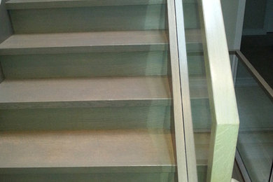 Hardwood stairs with glass railing