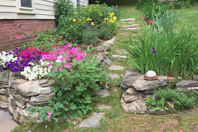Photo of a mid-sized traditional partial sun side yard mulch garden path in Boston.