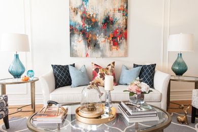 Transitional light wood floor living room photo in Toronto with white walls