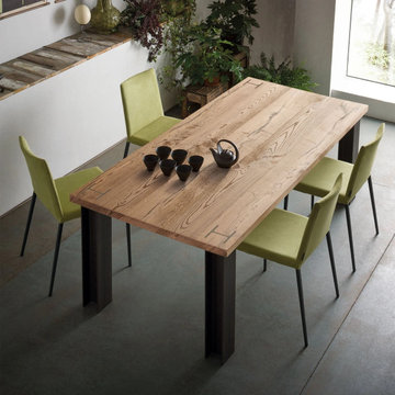 Power extending dining table with powdered steel girders by Sedit