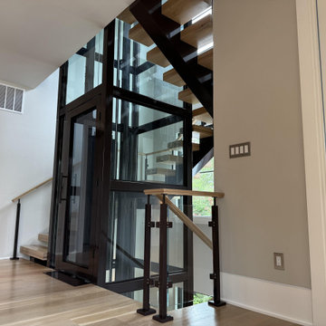 Project #136 | Modern Floating Staircase Encircling Glass Elevator