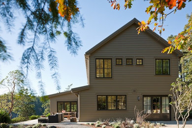 Mid-sized transitional two-story wood gable roof idea in Seattle