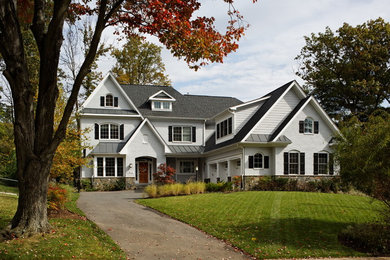 Large traditional white three-story mixed siding exterior home idea in DC Metro with a shingle roof