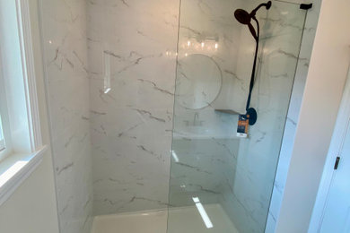 Small minimalist 3/4 black and white tile and porcelain tile ceramic tile, white floor and single-sink bathroom photo in Chicago with shaker cabinets, green cabinets, a two-piece toilet, beige walls, an undermount sink, quartz countertops, white countertops and a built-in vanity