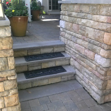 Paver Walkways and Pool Deck with Stone Veneer Retaining Wall