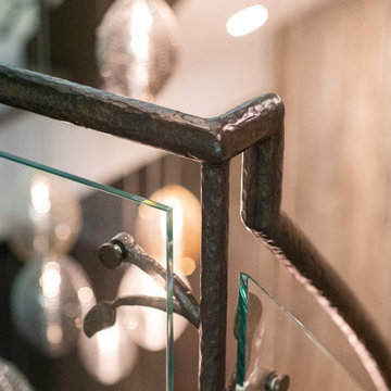 NATURE'S EMBRACE OF IRON AND GLASS RAILING