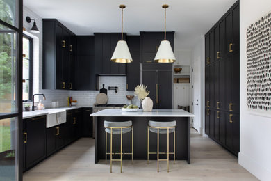 Kitchen - modern kitchen idea in Austin with black cabinets, marble countertops and brick backsplash