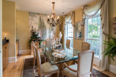 Ornate light wood floor and brown floor kitchen/dining room combo photo in Phoenix with beige walls and no fireplace