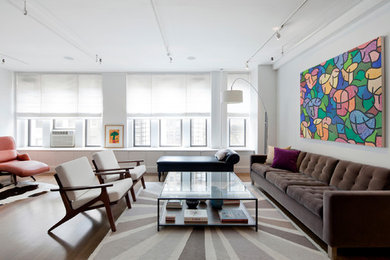 Inspiration for a large modern formal and enclosed medium tone wood floor and brown floor living room remodel in New York with white walls and no tv