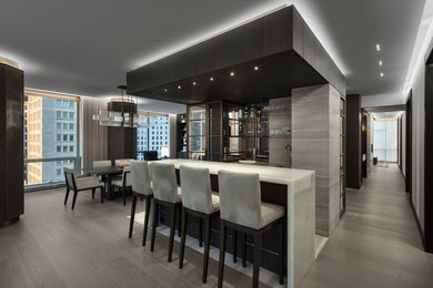 Example of a trendy home bar design in New York