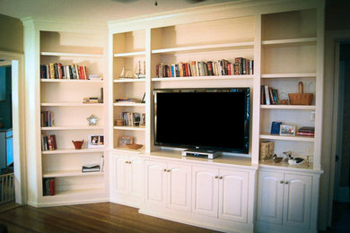Living room library - mid-sized traditional open concept light wood floor living room library idea in Philadelphia with white walls, no fireplace and a tv stand
