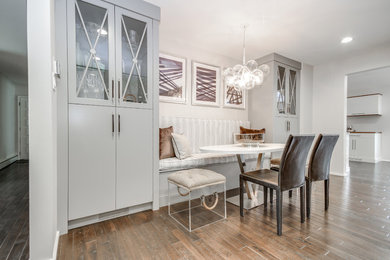 Mid-sized trendy light wood floor and brown floor kitchen/dining room combo photo in Philadelphia with white walls